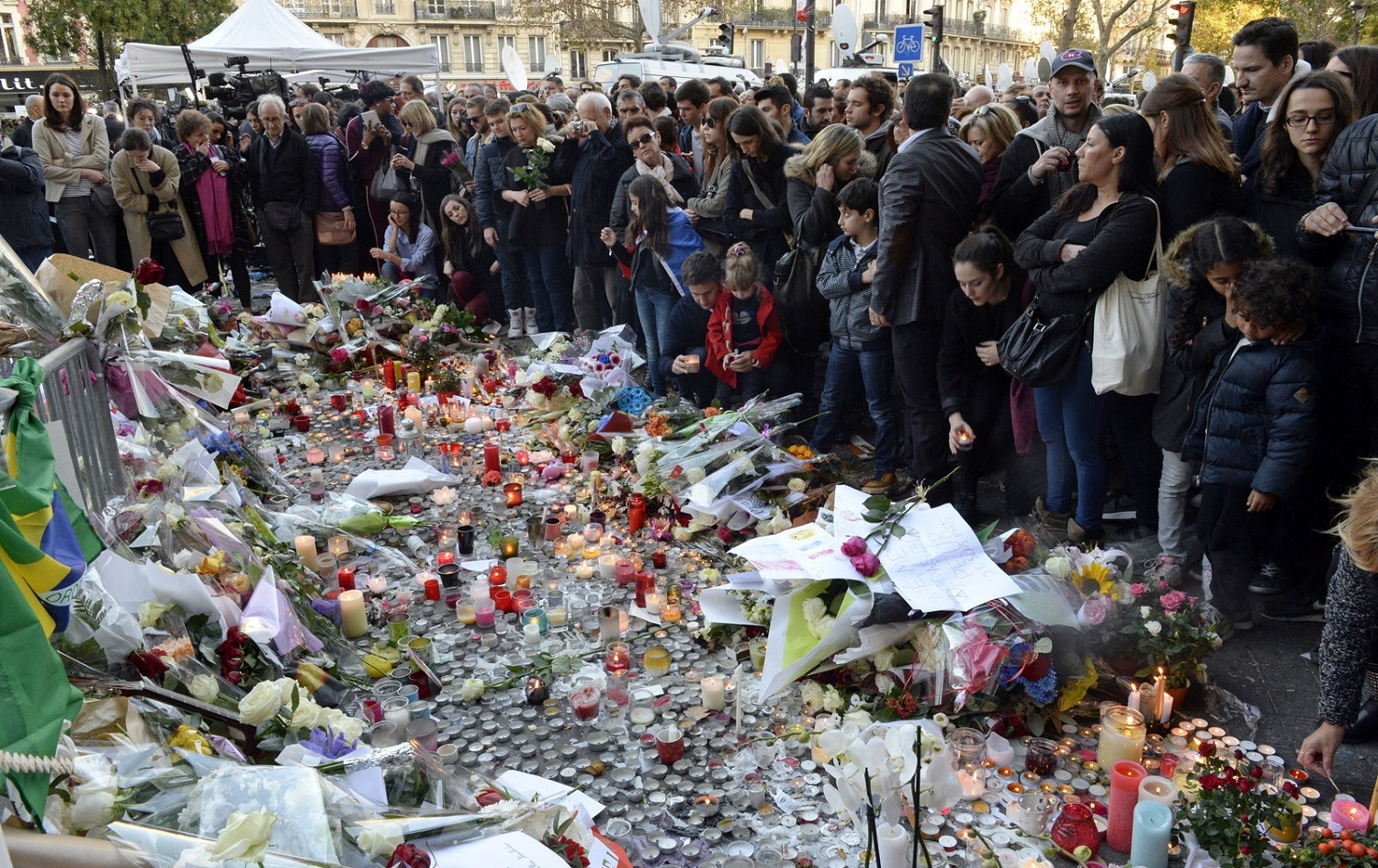 People gather at a memorial near the Bataclan in the days after the attack. Photo: AFP